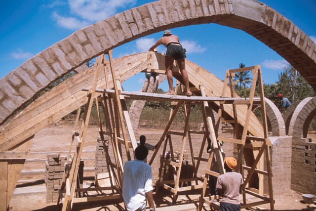 Exterior view showing construction of brick arch