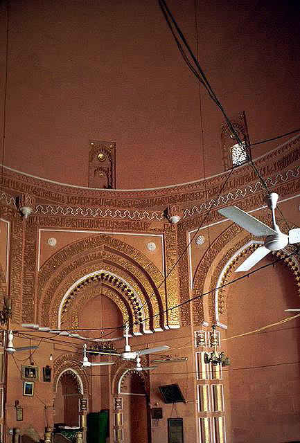 Interior view of mosque looking at arch and dome