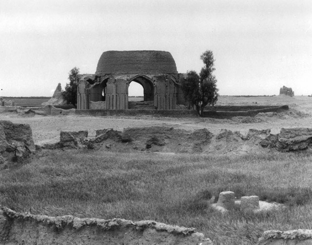 General view from northeast with tombstone in foreground