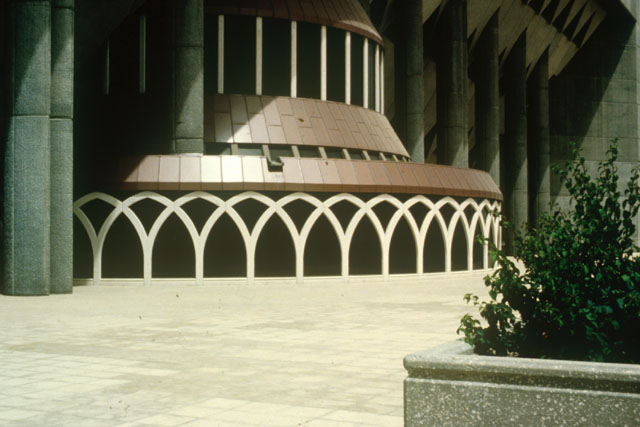 Exterior view showing decorative arches with copper tiling above