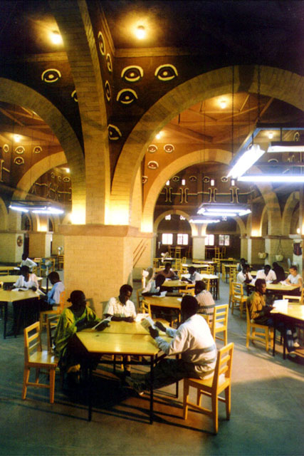 Interior view showing reading room with piers and arches and decorative details above the arches