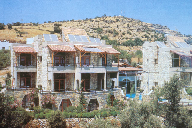 Exterior view showing stone façade against dusty landscape