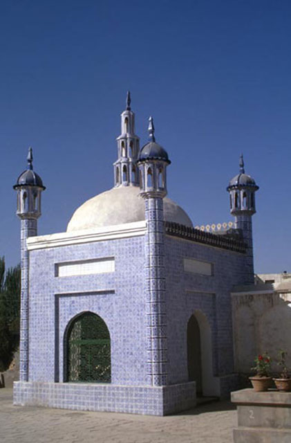 Exterior view, showing tile work of minarets and fixture surmounting the arch-dome