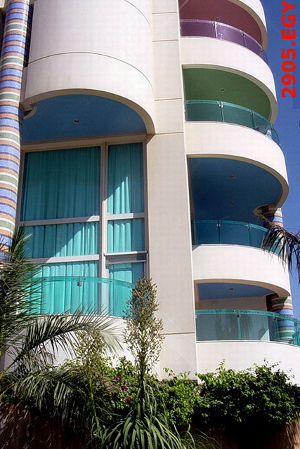 Exterior detail showing balconies with ceiling painted in different colors