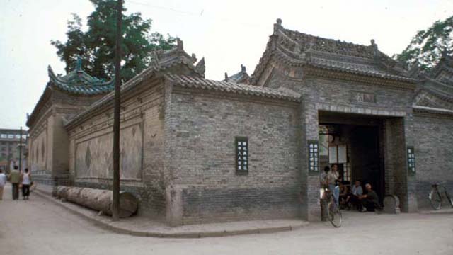 Exterior view looking southwest, showing the northern precinct gate and walls