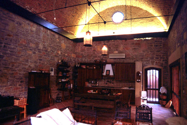 Interior view showing exposed brick vault and stone walls