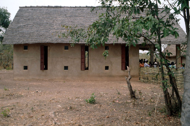 Exterior view showing mud brick façade