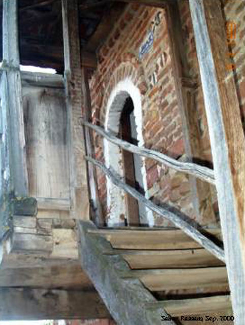 Wooden stair to upper floor entrance