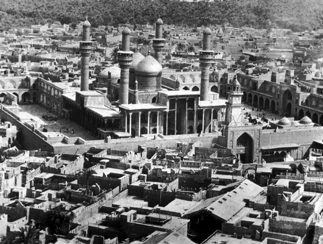 Bird's eye view of the shrine and its surrounding fabric from north west showing twin domes over tombs and the low dome covering the mosque