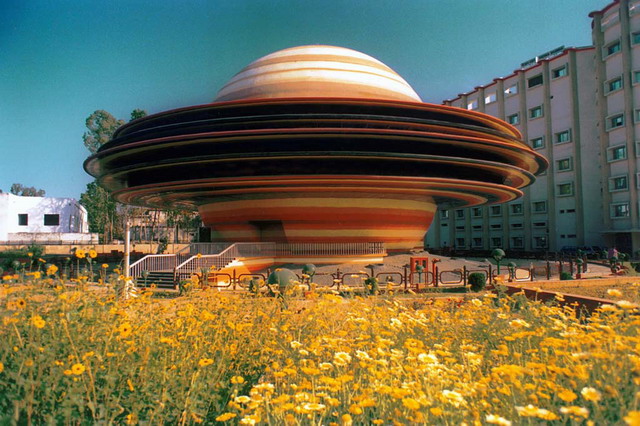 Side view of the planetarium with landscaping