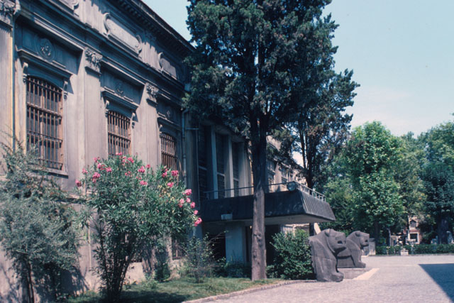 Exterior view showing entrance guarded by lions