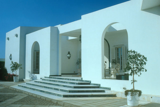 Exterior view showing white-washed façade