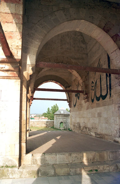 Exterior view of the right wing of portico, with the words "Hu" and "Allah" etched into the wall