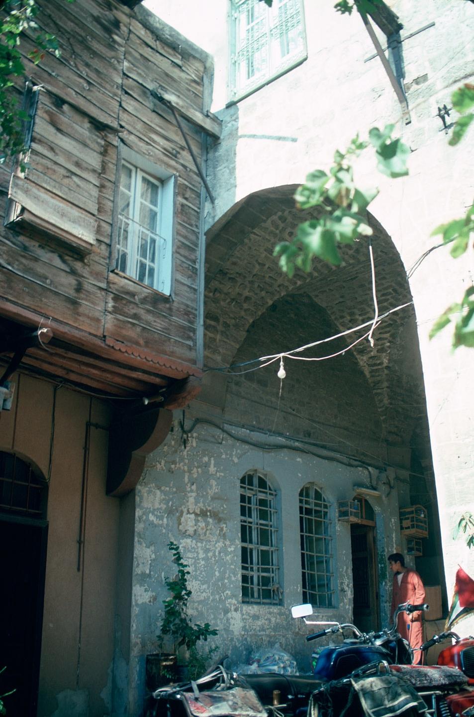 Exterior view of entrance arch and mashrabiyya