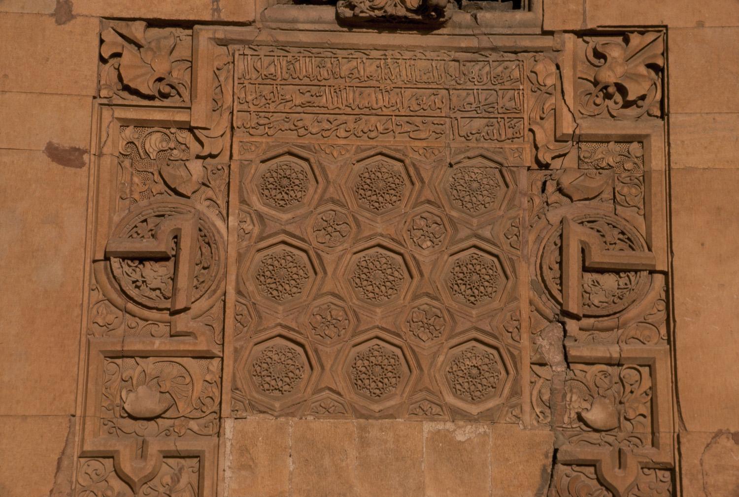 Carved panel above door