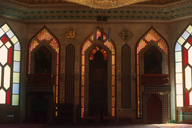 Interior detail showing elaborate glazing, carvings and inlay on qibla wall