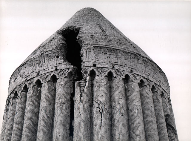 Exterior view, showing upper section of tomb with damaged dome