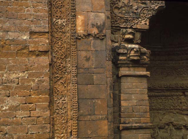 Detail of terra cotta carvings framing the mihrab niches