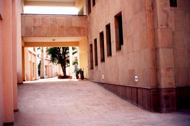 View of paved passageway between buildings