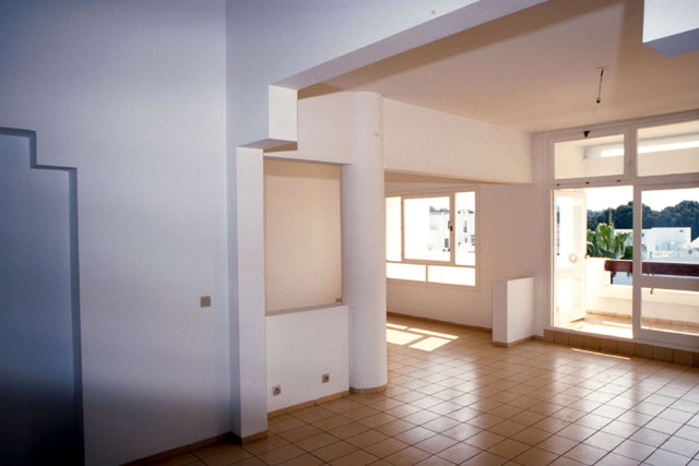 Interior view showing tile floors and concrete frame