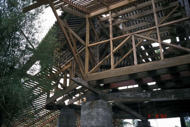 Exterior view, showing timber structure during construction