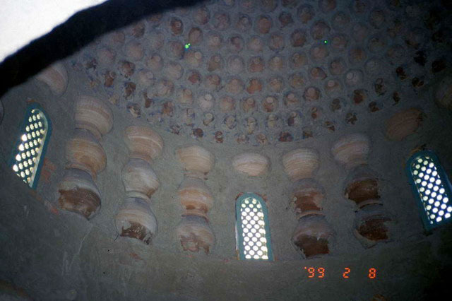 Interior view of pavilion, looking up at dome made of clay pots