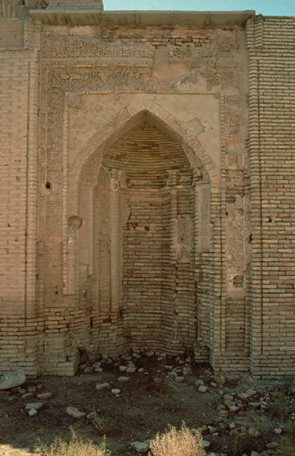View of brick mihrab with remaining stucco decoration