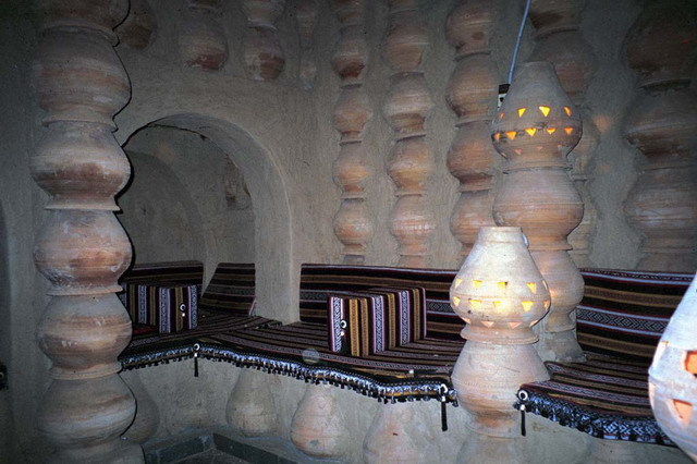 Interior view; columns, walls and seating area made of clay pots
