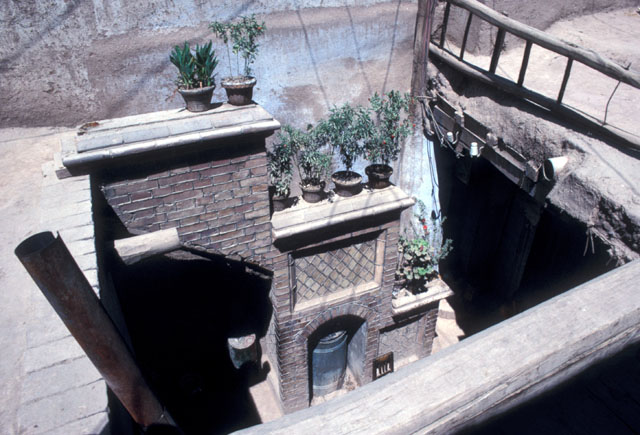 View down into courtyard from roof.  Note niche for heating vessel