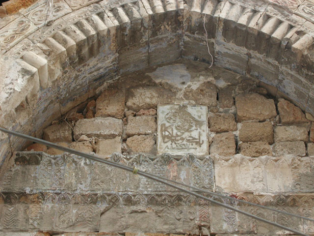 Inscription above the entrance gate: 'Bab hukumat akka' (from Arabic: 'gate of the government of Acre') and a turga (insignia) of the Turkish sultan - Abd al-Majid