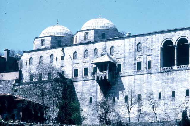 View of the upper and lower floors of the Treasury-Bath Complex, marked by the twin domes at one end and the open loggia on the other.  View taken from the Sea of Marmara, looking west