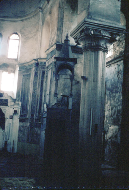 Interior view of southern church, looking east towards sanctuary.  In the foreground is a column supporting the dome, the minbar rests on the sanctuary wall behind it