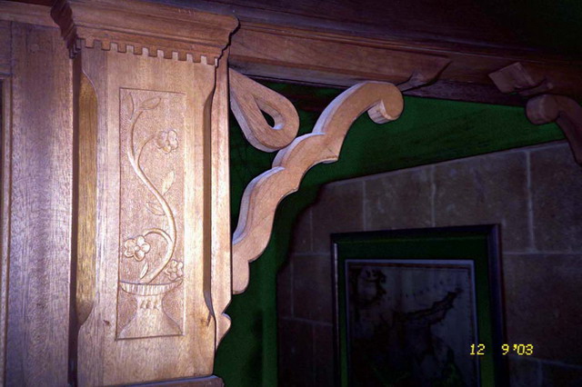 Interior detail, wooden column capital and bracket