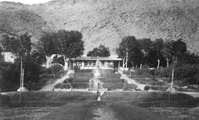 Exterior view from west across terraced gardens, circa 1916-1917