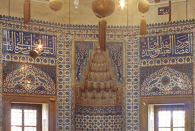 Interior detail showing muqarnas hood of niche and tile revetment