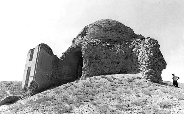 Exterior view from southeast showing remains of portal screen and iwan