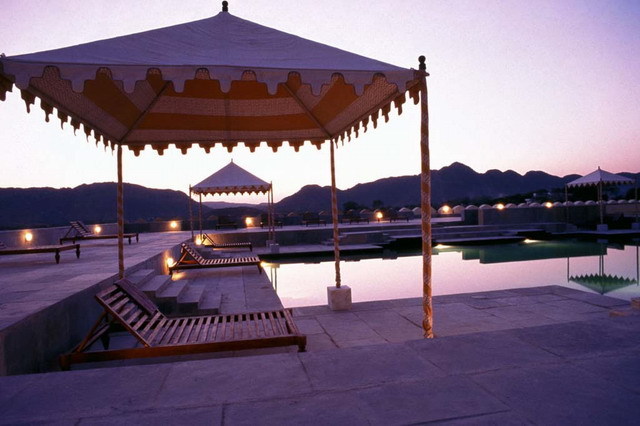 View of marble swimming pool, with canvas tents