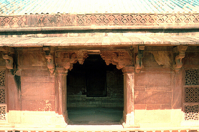 Exterior close-up of façade, entry and detailed corbels and overhang