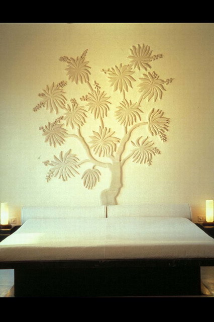 Interior view of Garden Suite, marble tree of life panel in bedroom