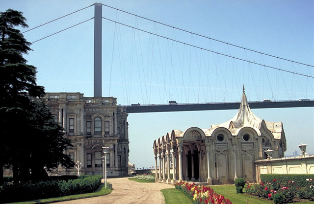 View of harem gardens at the Beylerbeyi palace; the Bosphorus bridge appears behind palace (left) and the harem sea kiosk (right)