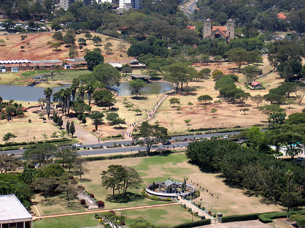 Elevated view of park looking southwest from KICC Tower, showing artificial lake. Jomo Kenyatta Mausoleum seen on the parliament grounds in the foreground