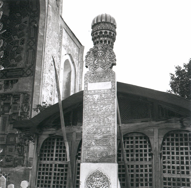 Inscriptive marble pillar in front of the wooden structure enclosing Ansari's tomb