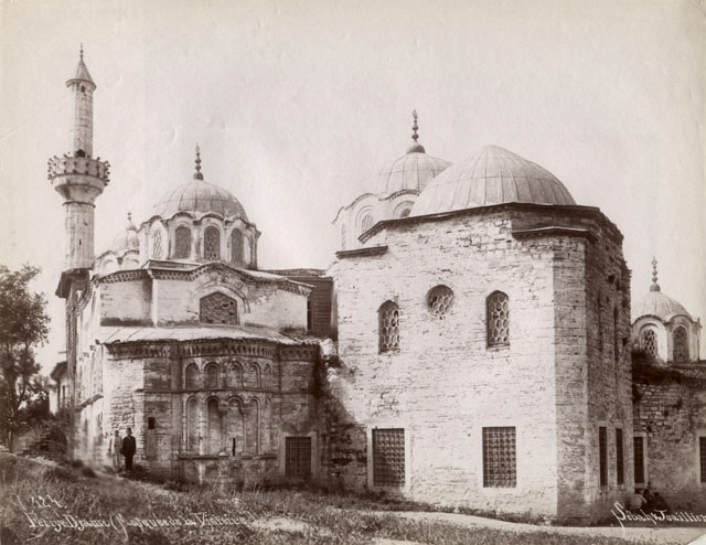 Fethiye Mosque - Exterior view from south, showing apse and dome of the parekklesion on the right, with minaret at its end.  At center, the Ottoman extension of the nave, which contains the mihrab