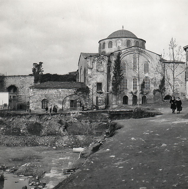 Exterior view from south, prior to the 1966 restoration, with the Aqueduct of Valens seen in the left background.  The minaret, which collapsed in 1930, is missing in this picture