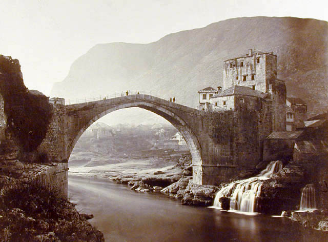 View of the the bridge and its defense towers; it replaced a wooden structure across the Neretva River
