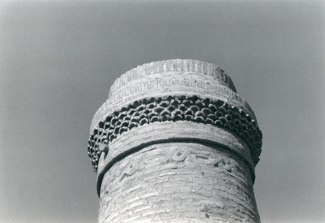 Detail of minaret, showing decorative brick ring and brick band with chain motif at top