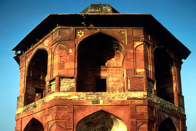 Exterior close-up view of Sher Mandal, looking at top half of tower