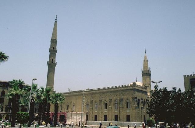 Exterior view with minarets and garden in front of mosque