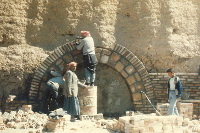 Exterior view showing re-construction of stone and mortar arch