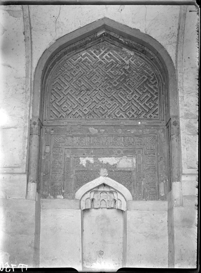 Detail of mihrab arch with panels of terracotta moldings